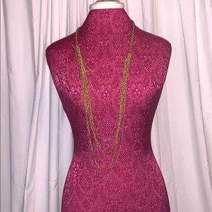 Multi strand gold colored costume necklace